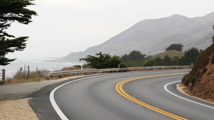 Pacific coast highway 1, Cabrillo road along ocean, foggy California, Big Sur, USA. Coastal road...