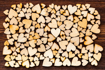 Wooden hearts as a background. The texture of figurines in the form of hearts as a romantic...