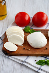 Homemade Mozzarella Cheese with Tomato, Basil and Olive Oil, low angle view.