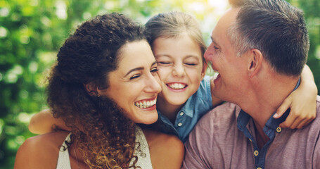 Nothing can take the place of time spent with family. Shot of an affectionate little girl spending quality time with her mother and father outdoors.