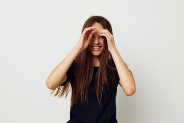 young beautiful woman in a black t-shirt hand gesture fun Lifestyle unaltered