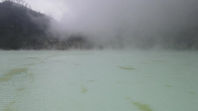 Aerial view fly through smoky in white crater, bandung, Indonesia