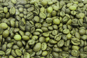 green coffee beans. concept of weight loss methods. raw coffee seeds	