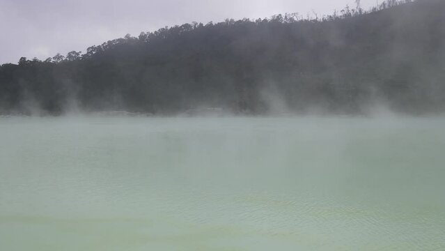 Aerial view fly through smoky in white crater, bandung, Indonesia