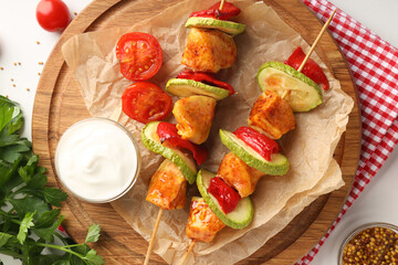 Concept of tasty food with chicken shashlik on white background