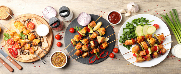 Concept of tasty food with chicken shashlik on light wooden background