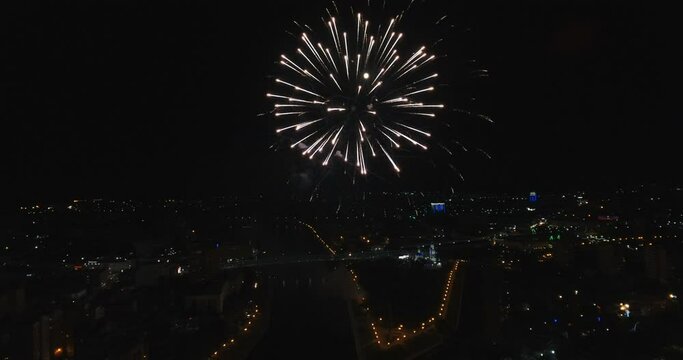 Night fireworks over the city. Aerial photography. Aerial view of fireworks.
