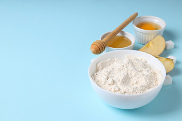 Ingredients for pie or cake cooking on blue background