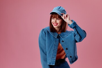 Beautiful fashionable girl denim clothing fashion posing cap color background unaltered