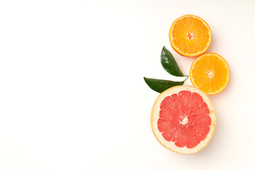 Citrus fruits on white background, space for text