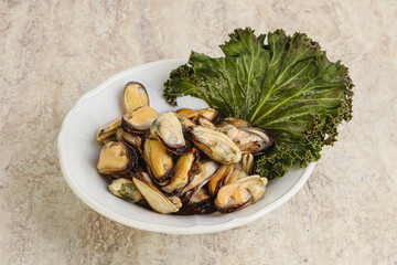 Tasty marinated mussels in the bowl