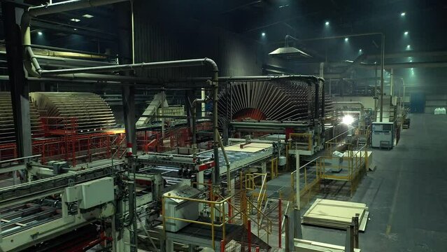 Flying along a huge workshop of a woodworking plant