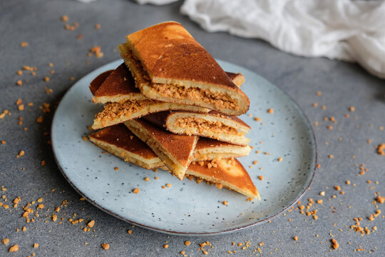 Homemade popular street food. Apam Balik aka Malaysian Foldover Pancake. Made from all purpose and self rising flour, yeast, egg. When cooked fill generously with ground peanuts and sugar and fold