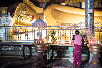 Buddhist woman praying inside Sadan Cave (aka Saddar Caves), Hpa An, Kayin State (Karen State), Myanmar (Burma)