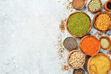 A set of cereals and legumes: rice, peas, lentils, beans, mung beans, buckwheat, chia, corn and chickpeas. Top view.