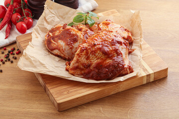 Marinated chicken leg in tomato sauce
