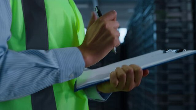 Storekeeper counting boxes checking supply shipping process hands closeup