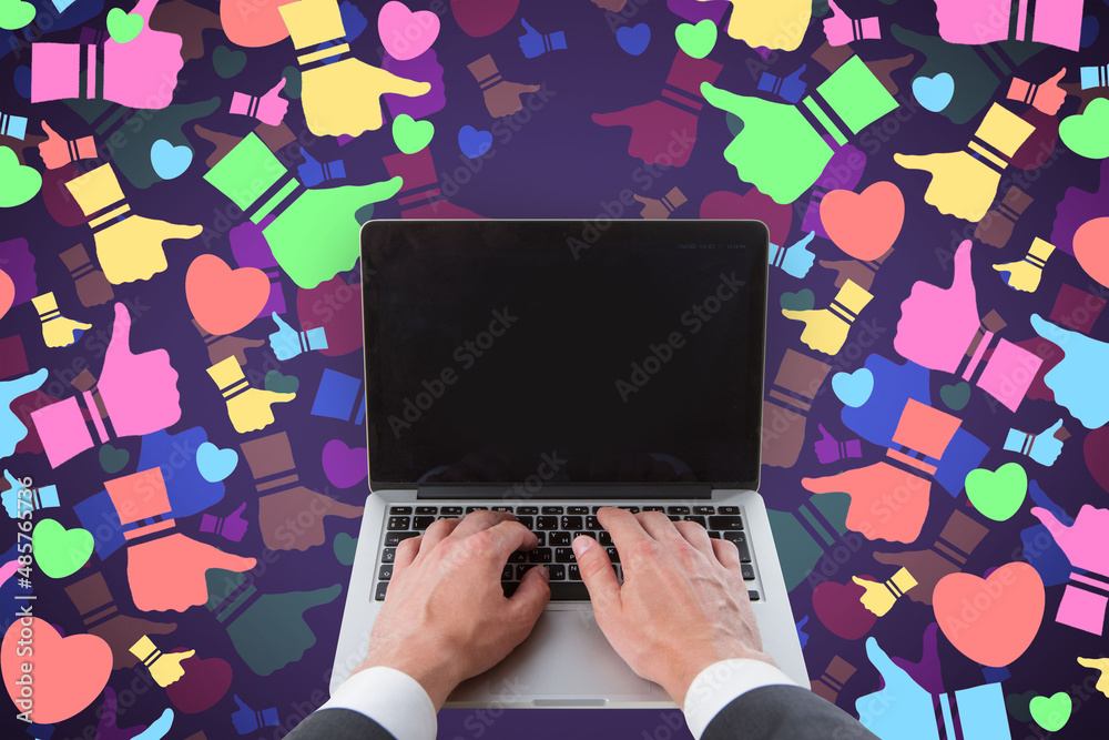 Poster Close up of hands using laptop keyboard with mock up screen on abstract colorful social media icons on blurry background. Communication, feedback and connection concept.