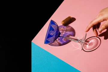 blue vintage champagne creman glass on a multicolored background. Stylish design photo