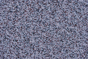 Dark brown marble chip plaster wall texture