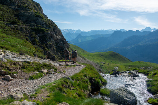 hikers  in path of Pic du Midi Ossau in French Pyrenees mountains