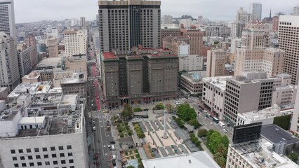 Aerial descending shot of Union Square in Downtown San Francisco on an overcast day. 4K