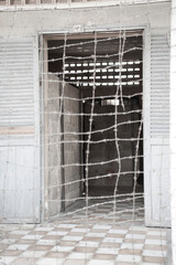Barbed Wire at the Tuol Sleng Genocide Museum (S-21 Prison), Phnom Penh, Cambodia, Southeast Asia - obrazy, fototapety, plakaty