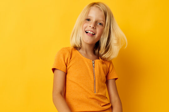 portrait of a little girl blonde straight hair posing smile fun isolated background unaltered