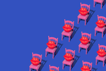 Valentines day creative pattern with red lips figurines on pink restaurant chairs on bright blue...
