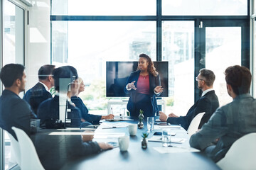 Lets pivot for a second. Cropped shot of an attractive young businesswoman giving a presentation in the boardroom.