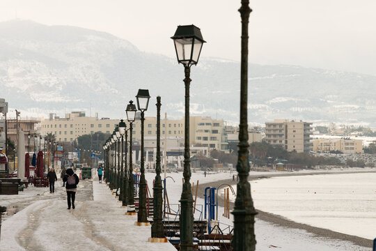 Next day of Elpis nature rare phenomenon with walking people walking at the snowy road.