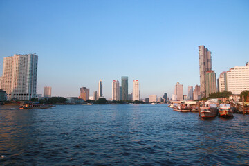 Tall buildings along the river in Thailand
