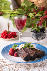 Moldavian dessert made from flour, eggs, soda and vodka called black babka. National cuisine. Traditional dishes in an authentic interior.