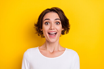 Photo of young cheerful excited girl information discount face reaction isolated over yellow color...