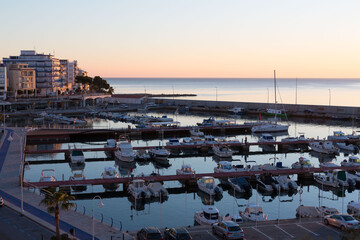 Fototapeta na wymiar Small marina in the town of La Ampolla, Tarragona, Catalonia, Spain.