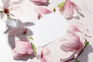 Springtime floral mockup with Magnolia. Beautiful pink magnolia flowers with singlight. Wedding, romantic stationery mock-up scene. Blank horizontal greeting card 