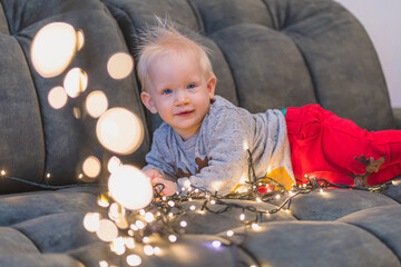 child with Christmas light
