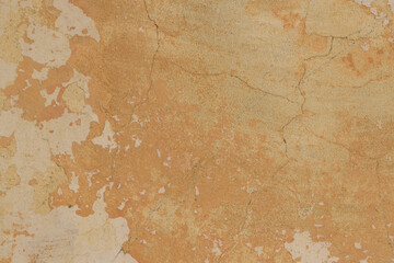 Old beige and cream wall texture. Texture of the old worn wall with several layers of beige and...