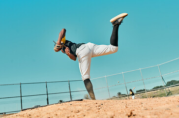 All it takes is all youve got. Shot of a young baseball player pitching the ball during a game...