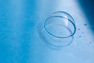 soap bubble close up. abstract blue water background