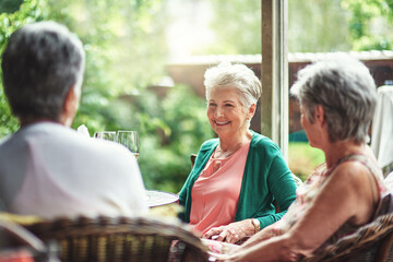 Good old friends getting together for drinks. Cropped shot of a group of senior female friends enjoying a lunch date.