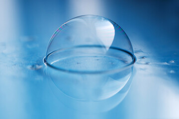 soap bubble close up. abstract blue water background