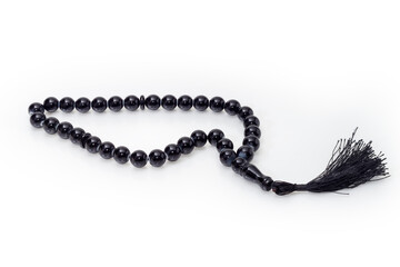 Fototapeta premium Black prayer beads on a white background