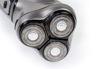 Head of rotary electric shaver, close-up in selective focus