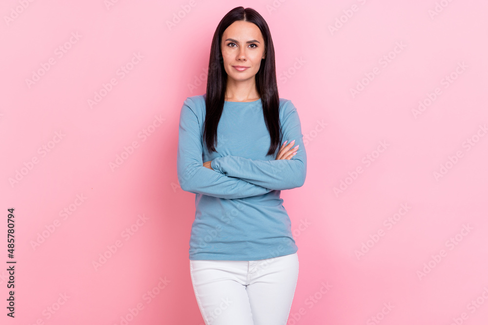 Wall mural photo of adorable confident lady dressed blue shirt smiling arms crossed isolated pink color backgro