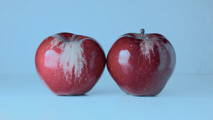 red bright ripe apples close-up on a blue background, healthy eating, natural vitamins