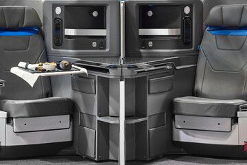 Business class commercial airplane seats. First class transportation. Aviation