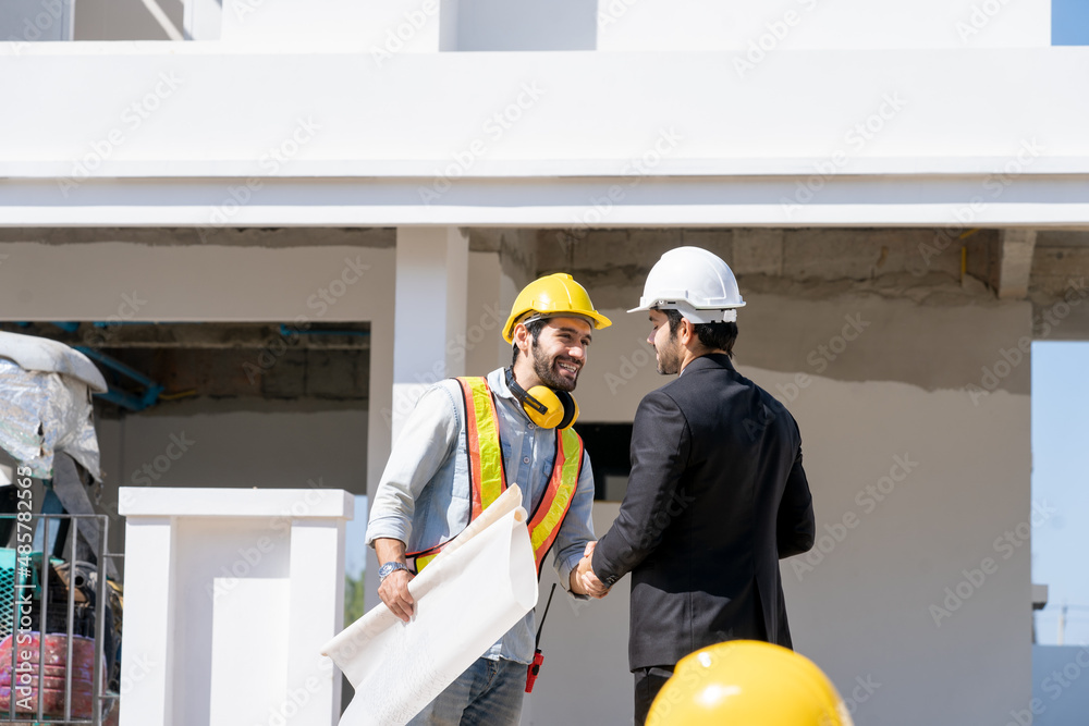 Poster Businessman and Engineer discussing architect project at construction site,Development and construction industry concept.