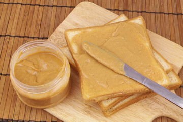 Peanut butter spread with bread slices