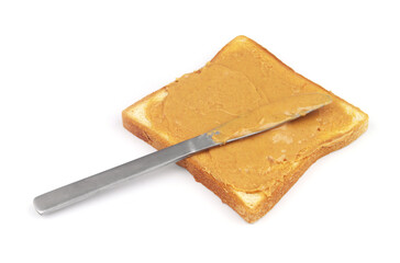 Peanut butter with white bread slice and table knife isolated on white 